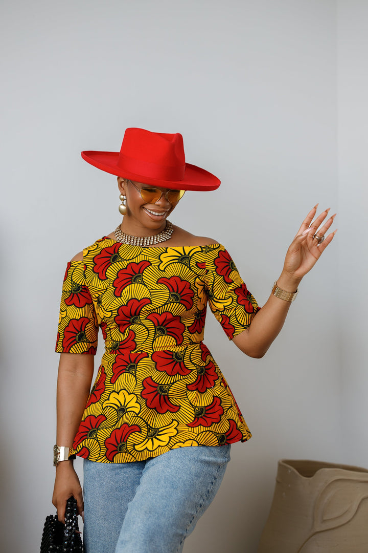IMARA AFRICAN PRINT ASYMMETRIC PEPLUM TOP [ORANGE]