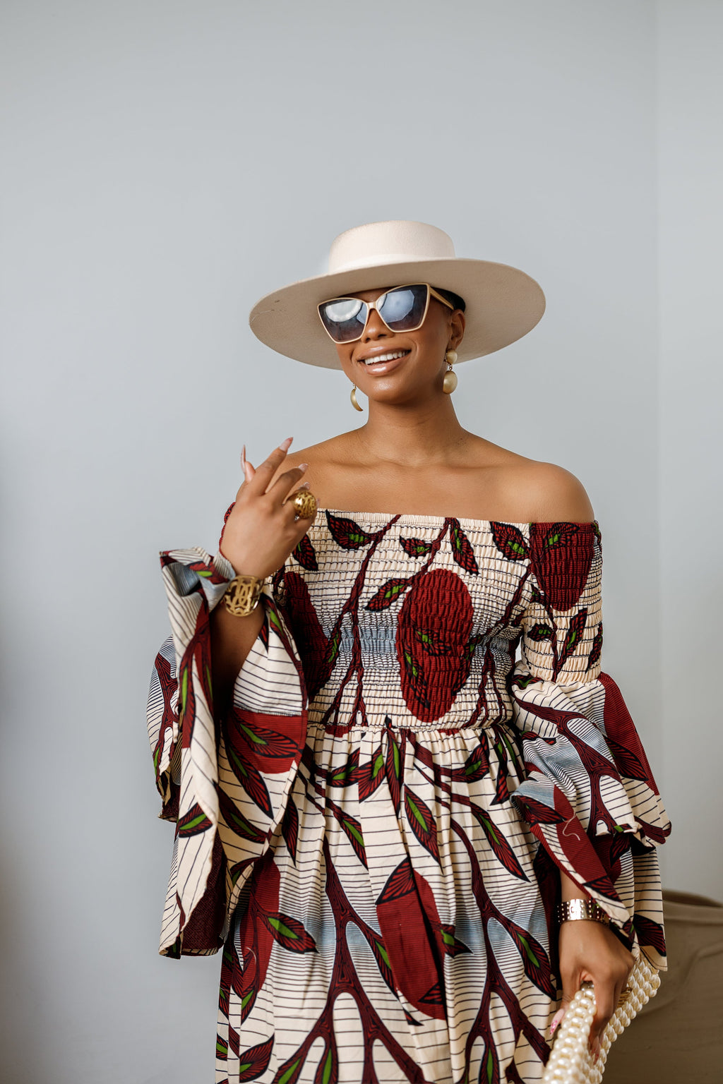 BISI AFRICAN PRINT SMOCKED OFF SHOULDER MIDI DRESS