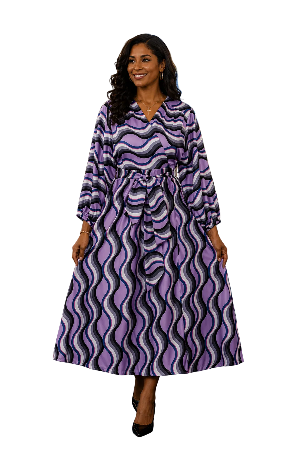 Woman in a purple and white patterned dress standing in a church aisle.